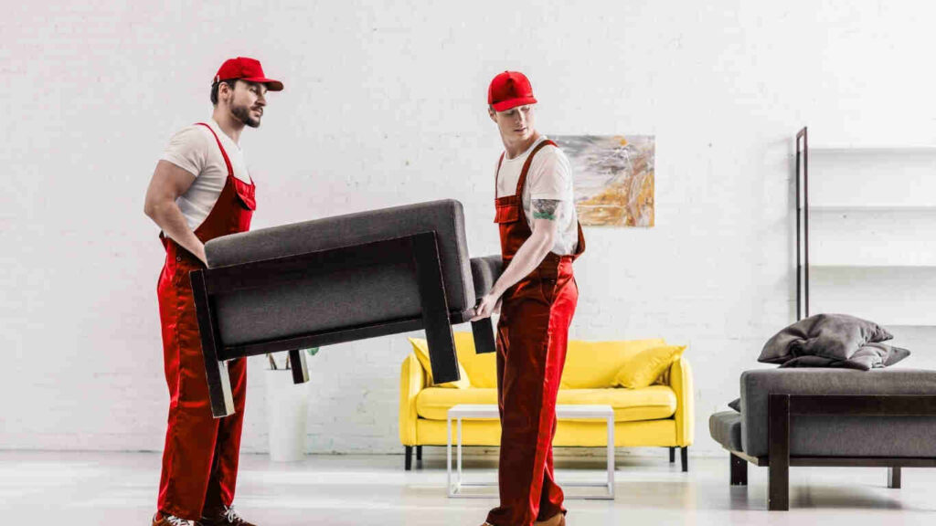 Professional office furniture movers in Dubai packing desks and chairs safely