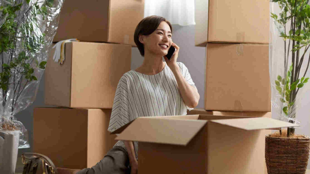 Team packing furniture and boxes during house packing and moving service