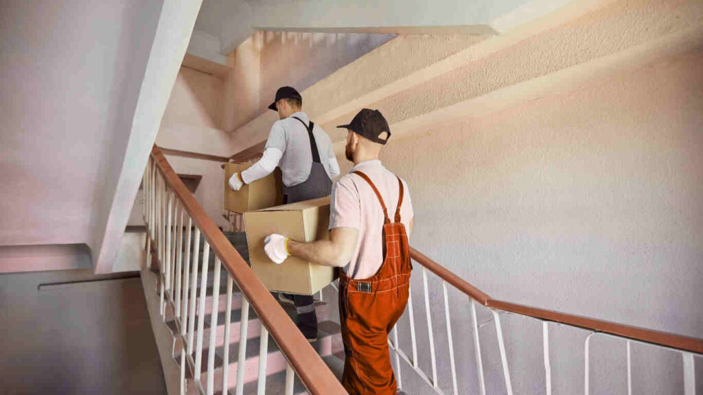 Professional office movers in Dubai carefully packing office desks and electronics