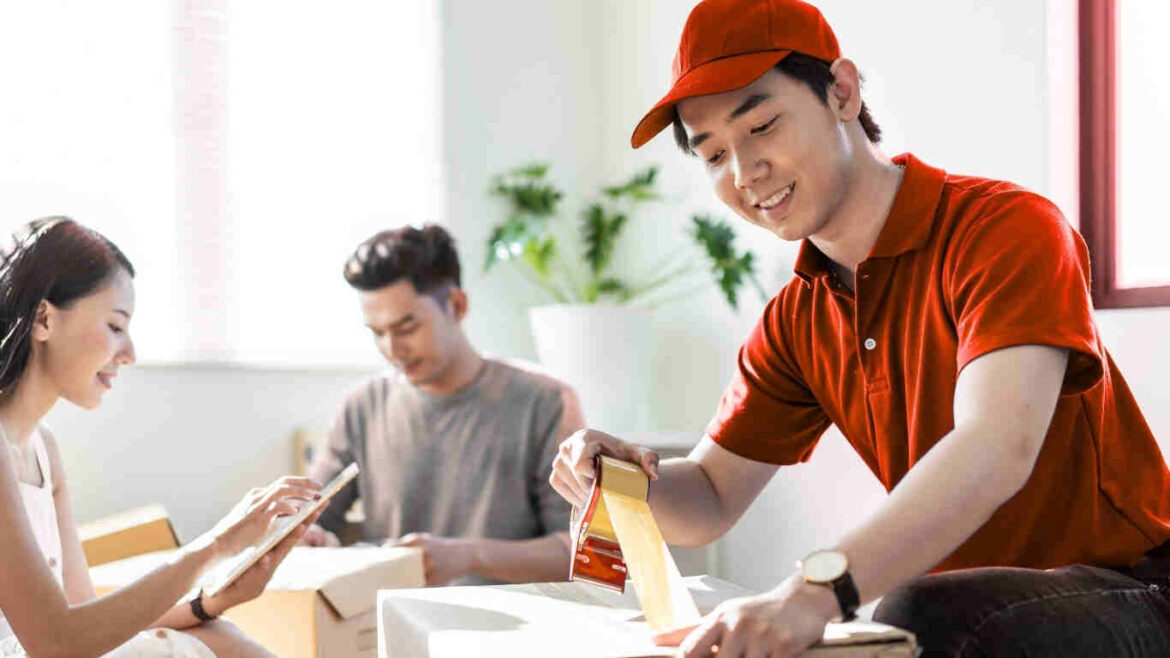 Professional movers from the best packing and moving company in Dubai handling furniture safely