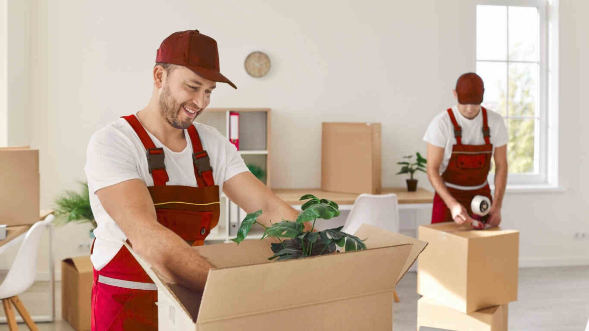 Team providing trusted office relocation services while packing office equipment safely