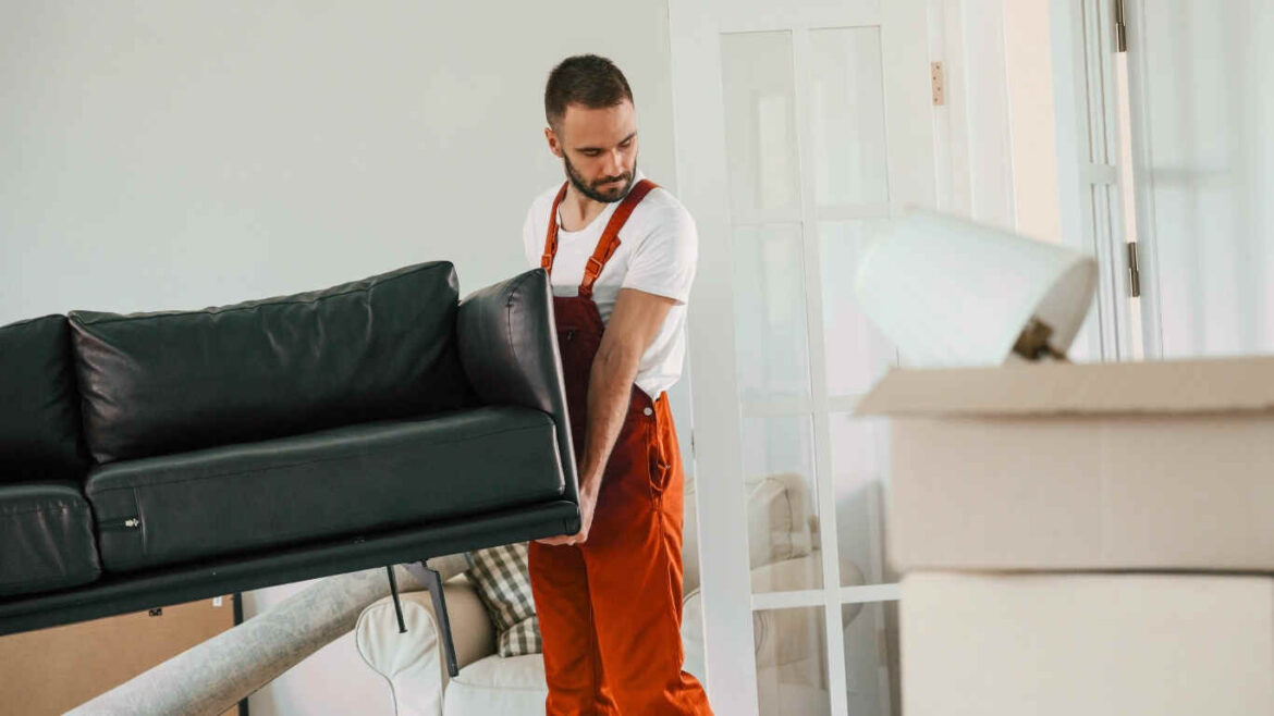 Professional office furniture movers packing desks and chairs in Dubai