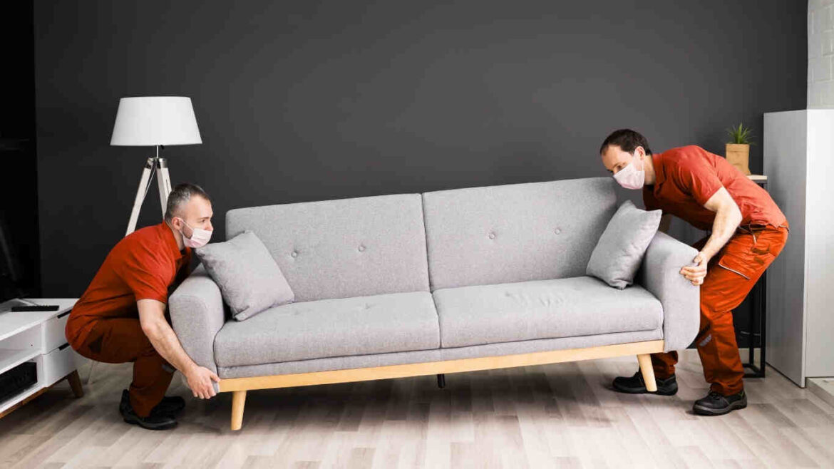 Experienced office furniture movers in Dubai loading furniture into trucks
