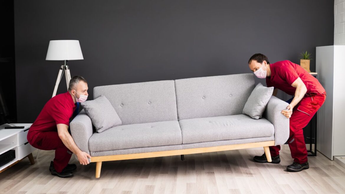 Professional team of safe expert packers and movers packing home items securely